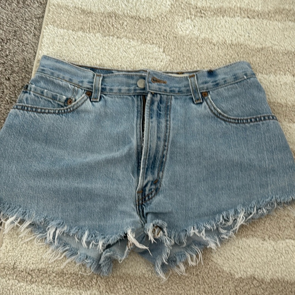 Levi’s 501 denim shorts, bottom is asymmetrical